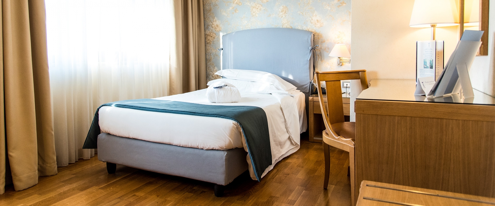 Camera singola ricca di comfort all'Hotel Touring