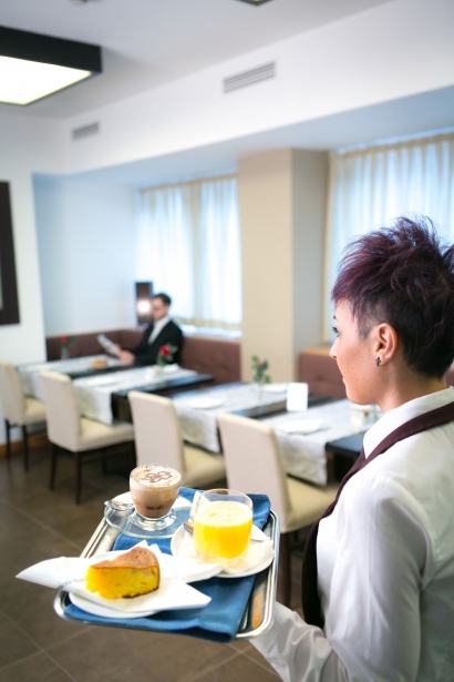 Kindness and courtesy in the breakfast room of the Hotel Touring Carpi